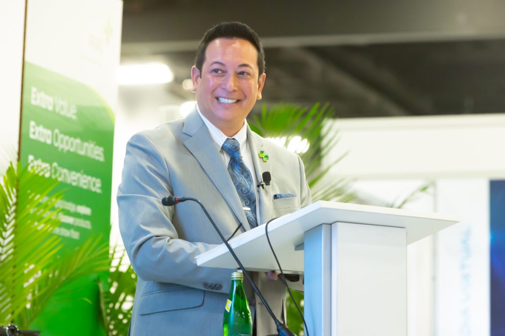Kenneth C. Wong, MBA, FACHE, at the podium at WHX Miami 2024